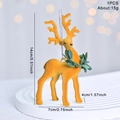 Ginger flocked reindeer Christmas tree ornament with green collar and silver string - Flocked Ginger Yellow Reindeer