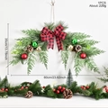 Christmas wreath with pine needles, bows and balls hanging on a white wall, 60x35cm - Artificial Pine Branch Bow Style (GH0103S-Artificial Pine Branch Bow Wreath-001)