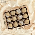 Set of 12 champagne flocked 6cm Christmas balls with glitter accents in a gift box - Khaki