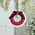 Mini Christmas wreath with red knit fabric, white fur trim and golden bell hanging on a tree - A-Style Red