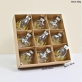 Set di 9 decorazioni natalizie a goccia in PET trasparente con fiocchi d'oro - Oro