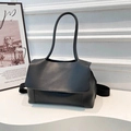 Minimalist black matte PU leather tote bag with thin top handles and wide shoulder strap - Black