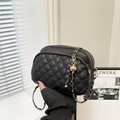 Black quilted leather shoulder bag with golden chain strap and tassel charm detail - Black
