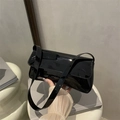 Glossy black patent leather baguette bag with flap closure and shoulder strap - Black
