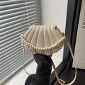 Chic off-white shell crossbody bag featuring elegant pearl chain and pleated texture - White