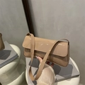 Minimalist beige patent leather baguette underarm bag with glossy finish and flap cover - Khaki