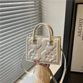 Fashionable white embossed handbag with dual handles and crossbody strap for women - White