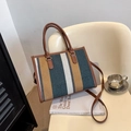 Minimalist striped canvas tote bag with brown leather handles and adjustable shoulder strap - Blue
