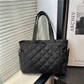 Black quilted nylon tote bag with rhombus pattern and convenient side pockets - Black Without Charm