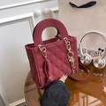Burgundy quilted crossbody bag with top handles and decorative golden key charms - Red