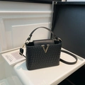 Black woven leather crossbody bag with gold V-shaped metal logo and adjustable strap - Black