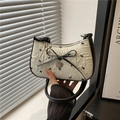 Cream pleated bow underarm bag with black butterfly prints and heart charm - Green