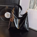 Glossy black hobo shoulder bag with fashion charms and gold lettering for women - With Pendant / Black