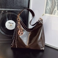 Deep coffee oiled leather underarm tote bag with golden charms on a vintage wooden desk - With Pendant / Brown