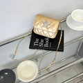 Mini borsa a tracolla trapuntata dorata con stella glitterata argento e catena metallo - Oro