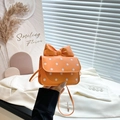 Mini orange crossbody bag with white polka dots and a large bow in faux leather - Orange