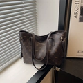 Dark brown tote bag with LNBOE monogram print and adjustable shoulder strap - Brown