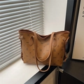 Brown monogram tote bag with cartoon patterns and side drawstring in a casual style - Brown