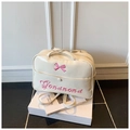 Borsa tote crema lucida con ricamo fiocco rosa e tracolle regolabili versatili - Bianco