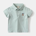 Detail of mint green cotton polo shirt featuring white buttons and bear chest embroidery - 90 / Green