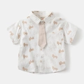 Dettaglio camicia a maniche corte per bambino con stampa di cavalli e cravatta abbinata - Bianco / 90cm