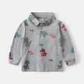 Detailed view of kids grey polo shirt with colorful dinosaur prints and soft cotton texture - 90cm / Gray