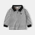 Detailed view of striped children's polo shirt with dinosaur embroidery and ribbed cuffs - Black & White Stripes / 90cm