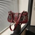 Leopard print underarm bag with deep red leather trim and bold silver buckle detail - Leopard Red