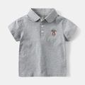Close-up of grey polo shirt featuring a bear embroidery and luckybear text on the chest - 90 / Gray