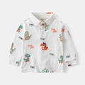 Detailed view of kids long-sleeve polo shirt with cartoon dinosaur patterns and buttons - 90cm / White