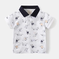 Detail of kid's white polo shirt featuring navy collar and cartoon crocodile print - White Print / 90cm