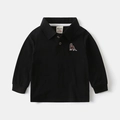 Detail of kids polo shirt featuring dinosaur embroidery and ribbed cuffs on black cotton - Black / 90cm