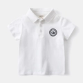 Detail of white cotton polo shirt collar with embroidered Peak Pines chest badge - 90cm / White