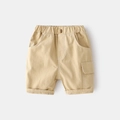 Detail of khaki cargo shorts for boys featuring elastic waist and contrast stitching - 90cm / Khaki