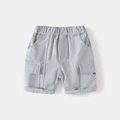 Detailed view of light gray cotton cargo shorts with side pockets and embroidery - 90cm / Gray