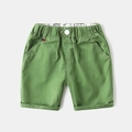Classic green cotton shorts for boys with elastic waistband and striped label detail - 90cm / Green