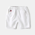 Classic white cotton shorts for boys with elastic waist and stylish tricolor label - 90cm / White