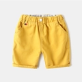 Classic bright yellow cotton shorts for boys with elastic waist and rolled cuffs - 90cm / Bright Yellow