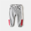 Fleece-lined boys' sweatpants in grey with white and red side stripes for winter comfort - Size 90 / Grey With Red Edge