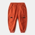 Kids casual cargo pants in orange brown with elastic waist and Hey embroidery - Brick Red / Size 90