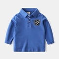 Königsblaues Langarm-Polohemd für Kinder mit besticktem Wappen und Knopfkragen - 90 / Blau
