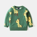 Dettaglio del maglione in maglia verde con motivo giraffa e colletto a costine - Etichetta 90 / Giraffa Verde