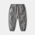 Pantaloni jogger grigi per bambini con vita elastica e ricamo arancione sulla tasca - 90 / Grigio Militare