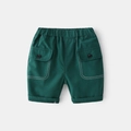 Dark green boys cargo shorts with elastic waist, flap pockets and white contrast stitching - Dark Green / 90cm