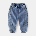 Stilvolle Jungen-Jogger in Blaugrau mit Gummizug und orangefarbenem Webetikett - Hellblau