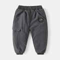 Detail of dark grey kids cargo pants featuring elastic waist and utility side pockets - 110cm / Gray