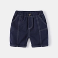 Detail of navy blue boys cotton shorts featuring elastic waist and contrast white stitching - 90cm / Dark Navy Blue