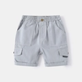 Macro view of blue cotton cargo shorts featuring elastic waistband and contrast stitching - Gray / 90cm