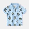 Detail of baby polo shirt collar with lion pattern and size label showing 90/52 - Sky Blue (Lion) / 110cm
