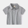 Detailed close-up of a grey cotton polo shirt collar with white buttons and size 90 tag - 90cm / Gray
